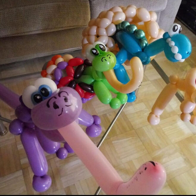 A trio of intricate balloon dinosaurs